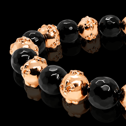 Raudono aukso apyrankė su oniksu