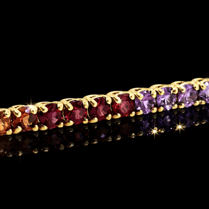 Geltono aukso "Tennis" apyranke su spalvotais safyrais