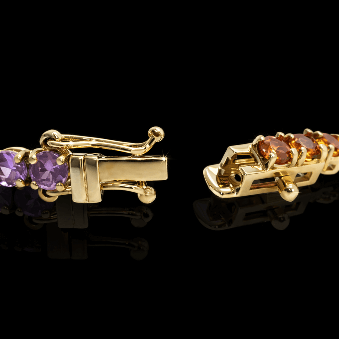 Geltono aukso "Tennis" apyranke su spalvotais safyrais