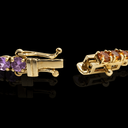 Geltono aukso "Tennis" apyranke su spalvotais safyrais